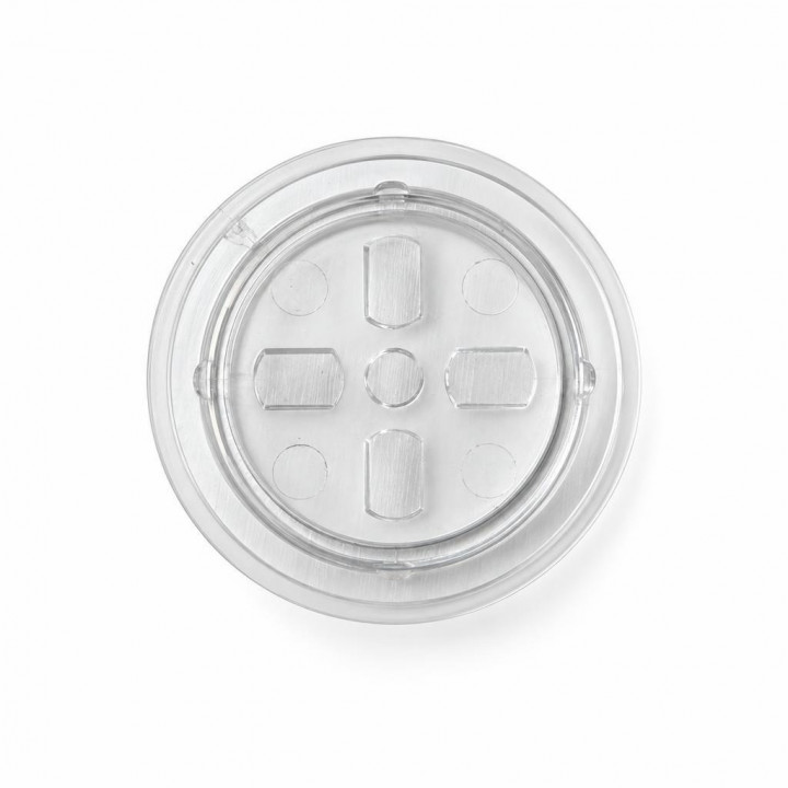 Clear Jenter cover plug with raised tabs, reverse side on a white background