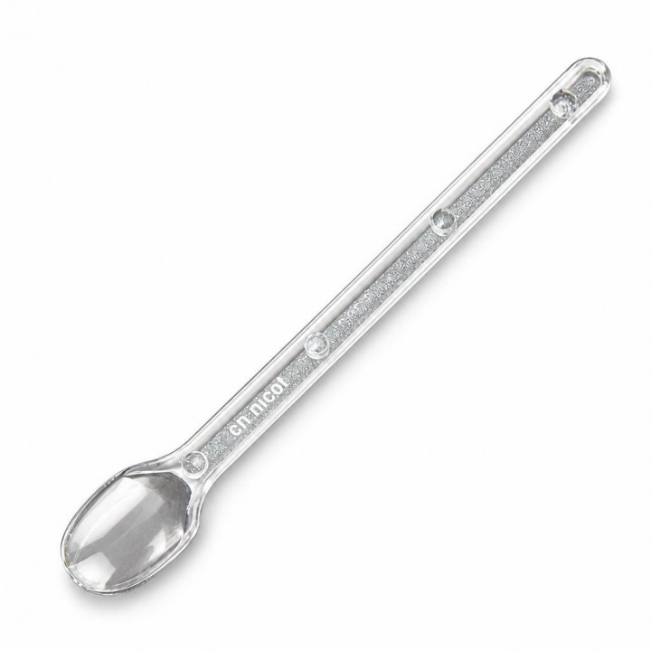 Clear Nicot royal jelly spoon angled on a white background