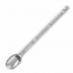 Clear Nicot spoon angled on a white background, handle pointing upward