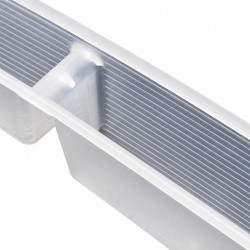 Close-up of the ribbed interior of a clear feeder on a white background