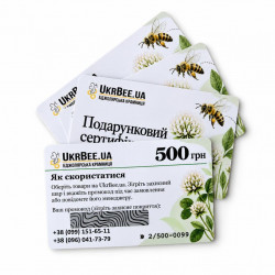 Several UkrBee UAH 500 gift certificates on white background, reverse side with instructions in front