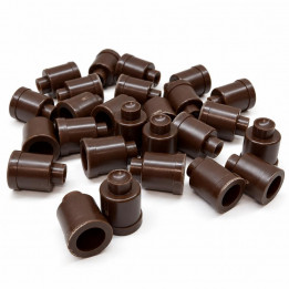 Pile of brown plastic Jenter bases on a white background